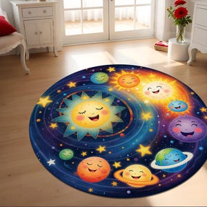 May include: A round, blue, and black space-themed rug with a swirling galaxy design. The rug features smiling cartoon suns and planets with stars in the background.