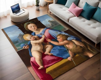May include: A vintage-style rug featuring a painting of a woman and two children. The woman is wearing a blue and pink robe and holding a child in her arms. The other child is standing next to her, holding a stick. The rug has a faded, antique look.