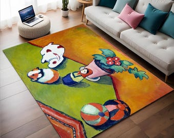 May include: A colorful abstract rug with a green, yellow, and orange background. The rug features a white, pink, and red flower, a doll, two guinea pigs, and a white ceramic object.