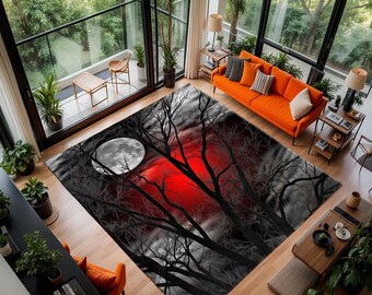 May include: A large area rug with a dramatic design featuring a full moon, a red sky, and silhouetted trees. The rug's color palette includes black, gray, and red, creating a striking contrast. The rug is placed in a modern living room setting.