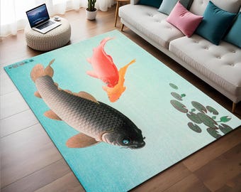 May include: A rectangular area rug featuring a Japanese-style illustration of koi fish swimming in a pond. The rug has a light blue background with a large black carp, a red koi, and a smaller orange koi. Lily pads are also depicted.