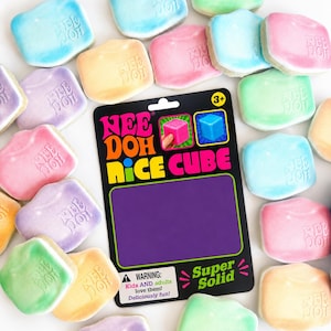 May include: A collection of squishy, cube-shaped fidget toys in pastel pink, blue, green, purple, and yellow, each embossed with the text Nee Doh. A black product display card features the text Nee Doh Nice Cube, Super Solid, and a warning.