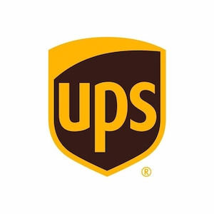 May include: The UPS logo, a shield shape, has a brown background and a gold upper section. The letters "ups" are in gold, with the registered trademark symbol in the lower right. The logo is set against a white background.