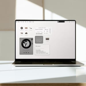 May include: A laptop screen displaying a digital desktop interface with various icons and widgets, including a New York City Ballet ticket, a music player widget showing Nice To Each Other by Olivia Dean, and a To Do list with daily tasks.