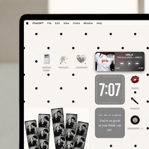 May include: A computer screen displaying a desktop interface with a white background featuring black polka dots. The screen shows various app icons, a music player widget playing The Kid LAROI, a digital clock widget, and photo strips.