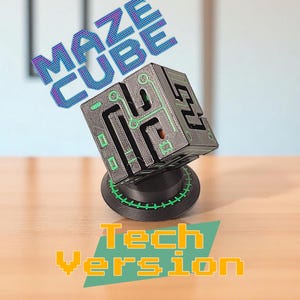 May include: A black and gray maze cube with green accents, mounted on a black base with a green trim. The text "MAZE CUBE" is above the cube, and "Tech Version" is below. The cube has a circuit board design.