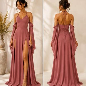 May include: A dusty rose floor-length gown featuring a V-neckline, thin halter straps, and long flowing off-the-shoulder sleeves. The skirt includes two high front leg slits, while the back displays a tie closure and a ruched waist detail.