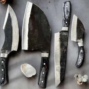 May include: A set of six knives with black handles and different blade shapes and sizes. The blades are made of metal and have a dull finish. The handles are made of wood and have a black finish.