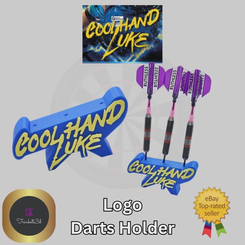 May include: A blue darts holder with the text "COOL HAND LUKE" in yellow. The holder is designed to hold three darts with purple and pink flights. The image also includes a logo and the text "Logo Darts Holder".
