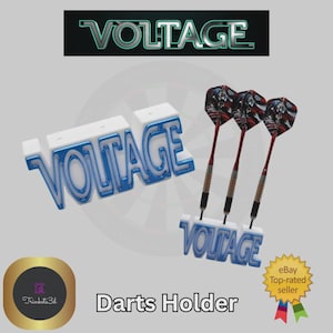 May include: A white and blue "VOLTAGE" darts holder with three darts. The darts have red shafts and patterned flights. The holder is designed to hold the darts upright. The image also includes the text "Darts Holder".
