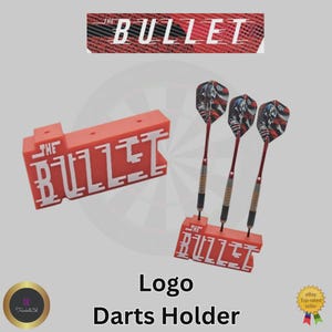 May include: An orange darts holder with the text "THE BULLET" in white. Three darts with red shafts and American flag-themed flights are displayed. The image also includes the text "Logo Darts Holder".