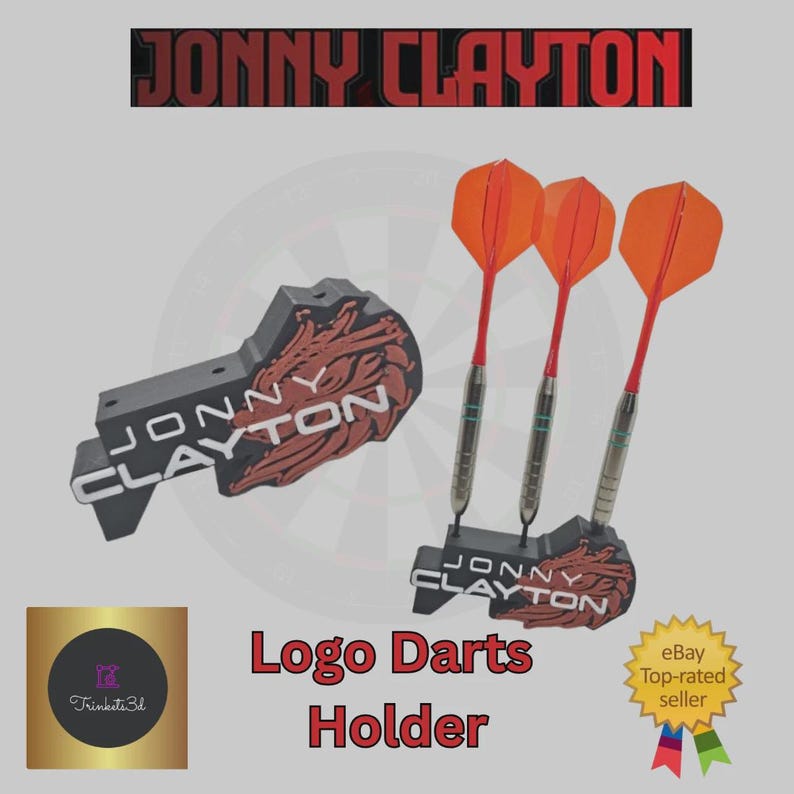 May include: A black and red logo darts holder with the name "JONNY CLAYTON" printed on it. Three darts with orange flights and silver barrels are displayed. The image also includes the text "Logo Darts Holder" and an "eBay Top-rated seller" badge.