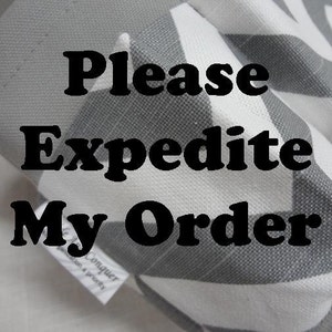 May include: A gray and white chevron patterned fabric with the text "Please Expedite My Order" in bold black letters. A small white tag is visible on the fabric.
