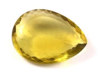 May include: A large, pear-shaped, yellow gemstone with a faceted cut.