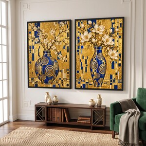 May include: Two rectangular wall art prints featuring blue vases with gold spiral patterns filled with white flowers against a background of gold and blue geometric shapes and circular motifs, displayed in black frames on a white wall.
