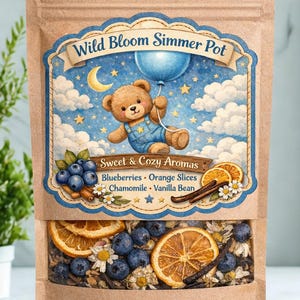 May include: A brown paper bag labeled "Wild Bloom Simmer Pot" with a blue and white illustration of a teddy bear holding a balloon. The bag contains blueberries, orange slices, chamomile, and vanilla bean. The text "Sweet & Cozy Aromas" is also visible.