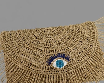 Bolso de mano boho chic de paja con detalle de ojo turco