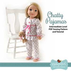 May include: A doll wearing a pink and white floral print pajama set with a ruffled trim. The pajamas have a button-up front and a pink ribbon at the waist. The doll is holding a small teddy bear. The image includes the text "Chatty Pajamas Intermediate Level PDF Sewing Pattern and Tutorial".