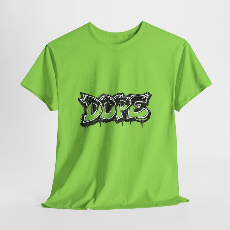 May include: A lime green t-shirt with the word "DOPE" in a black and white graffiti style design. The word has a dripping effect, adding a street art aesthetic to the shirt.
