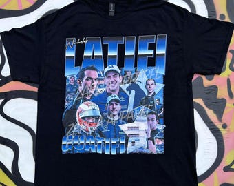 May include: A black short-sleeve t-shirt featuring a graphic print of Formula 1 driver Nicholas Latifi. The design includes multiple photographic portraits of the driver, blue and white star accents, and the text "Nicholas LATIFI GOATIFI".