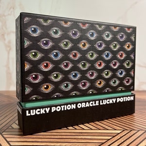 Lucky Potion Oracle: A 44-Card Guidance Deck Exploring a Mysterious World Filled w/ Potions & Magic - From the creator of Oddity Tarot