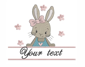 May include: Embroidered design of a brown bunny wearing a blue dress with a pink bow and surrounded by pink flowers. The text "Your text" is below the bunny.
