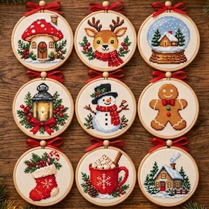 May include: Nine circular wooden embroidery hoops featuring cross-stitch designs of Christmas themes including a mushroom house, reindeer, snow globe, lantern, snowman, gingerbread man, stocking, cocoa mug, and a snowy cabin, each topped with a red ribbon.