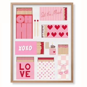May include: A framed print featuring a collection of matchboxes and related items in shades of pink and red. The design includes text such as "OH HI", "XOXO", "LOVE", and "Set the Mood". Other elements include hearts, cherries, and a lighter.