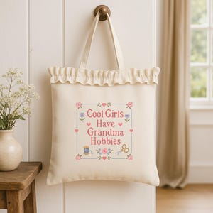 Celebrate your love for handmade hobbies with this funny grandma hobbies cross stitch pattern. The phrase Cool Girls Have Grandma Hobbies gives the design a trendy yet timeless feel, while the floral sampler details keep it classic and cozy. This PDF pattern is ideal for cross stitch enthusiasts, embroidery lovers, craft room decoration, stitcher gifts, and creative people who enjoy slow crafts, vintage aesthetics, and playful handmade wall art.