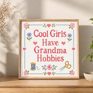 This counted cross stitch pattern combines humor, vintage charm, and classic handmade style. The quote Cool Girls Have Grandma Hobbies makes the design perfect for makers who love traditional crafts but want a playful modern message. The floral motifs, hearts, border, scissors, and thread details give it a nostalgic sampler look that feels cute, feminine, and cozy. A great PDF pattern for craft rooms, sewing rooms, and handmade gift projects.