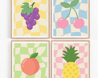 May include: Four framed prints featuring a checkered background and a different fruit on each. The top left print shows a bunch of purple grapes against a yellow and white checkered background. The top right print depicts two pink cherries on a blue and white checkered background. The bottom left print displays a peach on a green and white checkered background. The bottom right print showcases a yellow pineapple on a pink and white checkered background.
