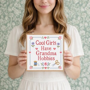 Cool Girls Have Grandma Hobbies is a modern funny quote cross stitch pattern with a traditional floral sampler style. The design includes sweet roses, small hearts, a stitched border, embroidery scissors, and thread spool details, creating a nostalgic handmade look. This PDF pattern is great for beginner and experienced stitchers who enjoy cute cross stitch projects, craft lover gifts, retro decor, and cozy feminine wall art with personality. Hot girls Have Grandma Hobbies