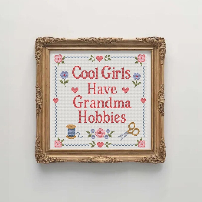 Cool Girls Have Grandma Hobbies cross stitch pattern is a fun instant download PDF for stitchers who enjoy cute quote designs and traditional sampler layouts. The pattern has a soft handmade style with floral accents, hearts, embroidery scissors, a thread spool, and a decorative stitched border. It is suitable for craft room decor, sewing room art, DIY gifts, beginner friendly stitching projects, and anyone who loves cozy hobbies with a funny modern phrase.