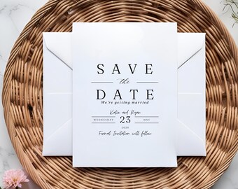 May include: Save the Date card with a white background and black text. The text reads "Save the Date" with a line under "Save" and a line under "Date". The text continues with "We're getting married" and "Katie and Ryan" followed by "Wednesday, May 23, 2026". The text concludes with "Formal Invitation will follow".