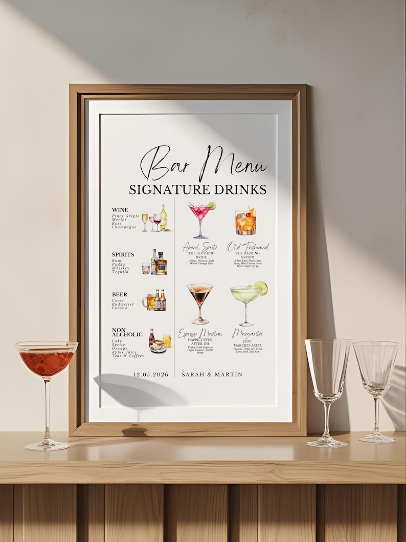 May include: A framed bar menu print with the text "Bar Menu Signature Drinks." The menu features watercolor illustrations of cocktails, wine, and spirits. Two empty wine glasses and a cocktail glass are in the foreground.