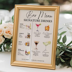 May include: A gold framed bar menu with the text "Bar Menu Signature Drinks". The menu includes illustrations of cocktails, wine, and spirits. The date "12.05.2026" and names "SARAH & MARTIN" are also displayed.