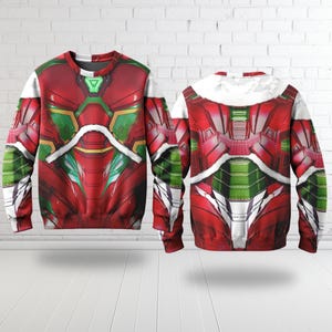 Puede incluir: Una sudadera gr&aacute;fica roja y verde con un dise&ntilde;o futurista. La sudadera presenta un patr&oacute;n detallado con detalles en blanco, verde y dorado. El dise&ntilde;o se repite en la parte delantera y trasera de la sudadera.