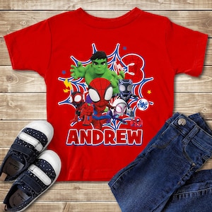 May include: A white ceramic mug with a black handle and the text "But First, Coffee" in a black, bold font. The mug is sitting on a wooden surface. The mug is approximately 4 inches tall.