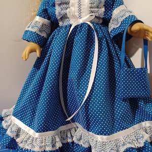 May include: A white ceramic mug with a black handle and the text "But First, Coffee" in a bold, black font. The mug is set against a blurred background, highlighting its simple design.