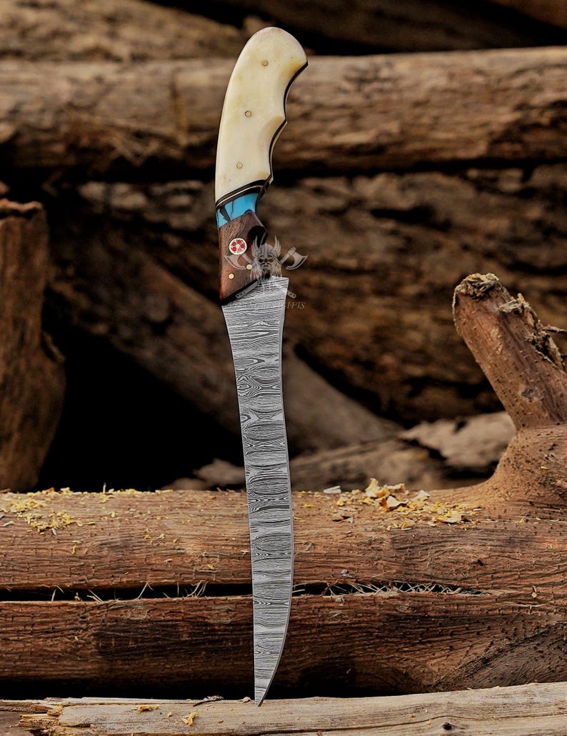 May include: A handcrafted knife with a curved, patterned blade. The handle features a bone grip, turquoise accents, and a wooden base with a decorative emblem. The knife is displayed against a backdrop of weathered wood.