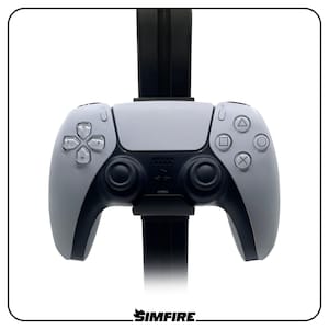 May include: A white and black wireless game controller mounted on a vertical black stand. The controller features a central touchpad, two analog sticks, a directional pad, and four action buttons marked with triangle, circle, cross, and square symbols.
