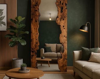 May include: A large, rectangular mirror with a natural wood frame. The frame has a live edge design, showcasing the wood's unique grain and texture. The mirror reflects a living room with a sofa, coffee table, and a floor lamp. The wood frame is approximately 72 inches tall.