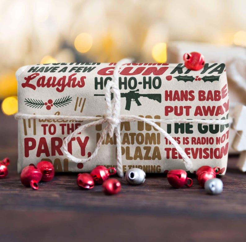 May include: A wrapped gift with a beige background and red and green text that reads "Have a Few Laughs" and "Ho Ho Ho". The gift is tied with twine and surrounded by red and silver bells.