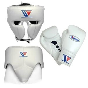 May include: A white boxing gear set consisting of a headgear, a groin protector, and a pair of lace-up boxing gloves. Each piece features the Winning logo with a blue and red graphic design. The equipment is constructed from white leather.
