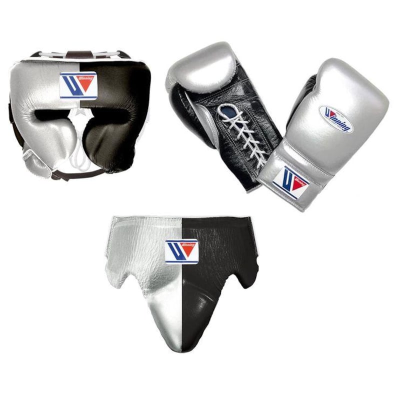 May include: A set of boxing equipment featuring a headgear, a pair of lace-up boxing gloves, and a groin protector. Each item is split into silver and black sections and displays the Winning brand logo with blue, red, and white text.