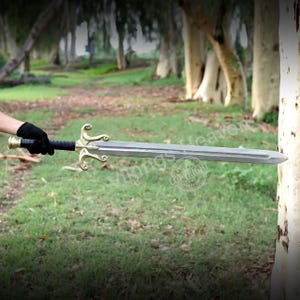 Fully handmade He-Man Power Sword replica with a carbon steel blade, solid brass guard and pommel, inspired by the Masters of the Universe movie. High-quality fantasy sword perfect for cosplay, display, or as a collectible gift for fans of classic 80s heroes.