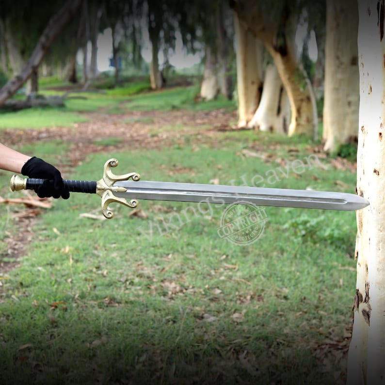 Fully handmade He-Man Power Sword replica with a carbon steel blade, solid brass guard and pommel, inspired by the Masters of the Universe movie. High-quality fantasy sword perfect for cosplay, display, or as a collectible gift for fans of classic 80s heroes.