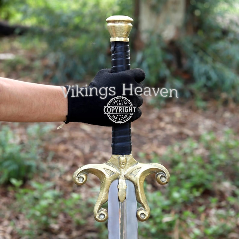 Fully handmade He-Man Power Sword replica with a carbon steel blade, solid brass guard and pommel, inspired by the Masters of the Universe movie. High-quality fantasy sword perfect for cosplay, display, or as a collectible gift for fans of classic 80s heroes.