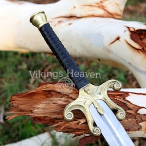 Fully handmade He-Man Power Sword replica with a carbon steel blade, solid brass guard and pommel, inspired by the Masters of the Universe movie. High-quality fantasy sword perfect for cosplay, display, or as a collectible gift for fans of classic 80s heroes.
