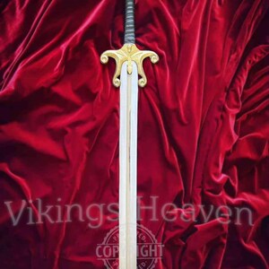 Fully handmade He-Man Power Sword replica with a carbon steel blade, solid brass guard and pommel, inspired by the Masters of the Universe movie. High-quality fantasy sword perfect for cosplay, display, or as a collectible gift for fans of classic 80s heroes.
